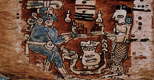 an old piece of art from the Mayan or Incan traditions showing two human like figures holding out plates with brown cubes of whats thought to be cacao